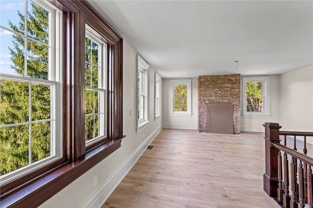 corridor featuring light hardwood / wood-style floors