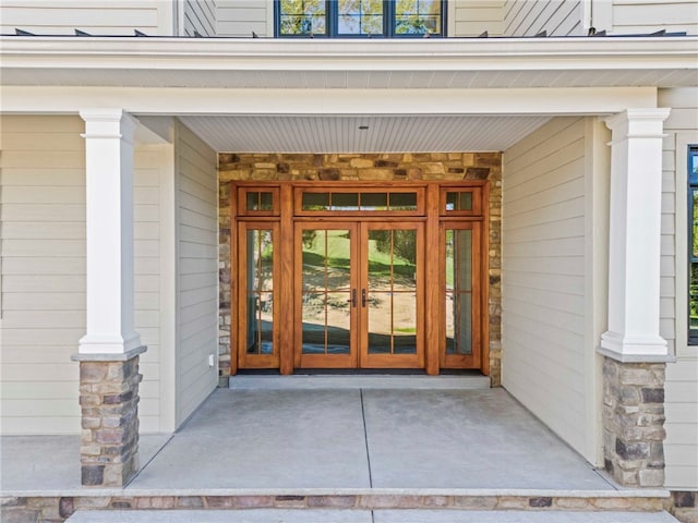 view of exterior entry featuring french doors