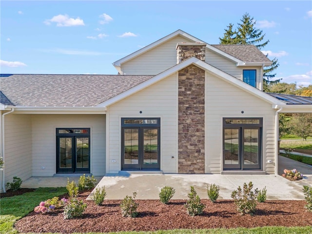 back of property featuring french doors