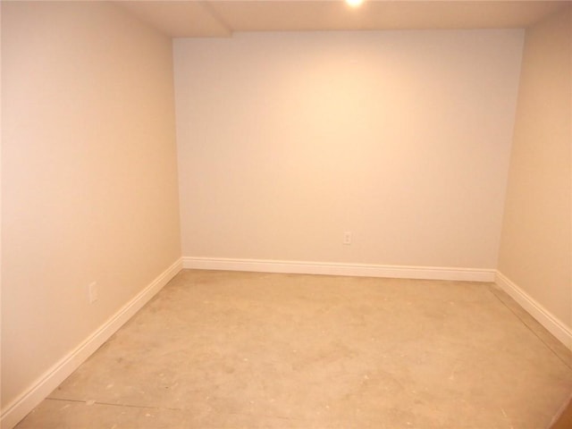 empty room with concrete flooring