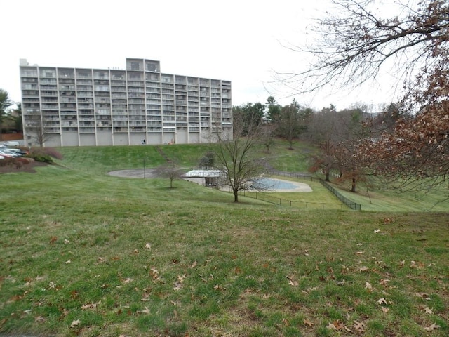 view of property's community with a yard