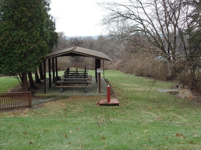 view of home's community with a lawn