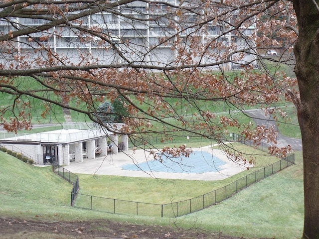 view of swimming pool featuring a lawn