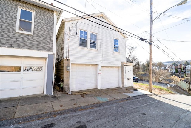 view of property exterior with a garage