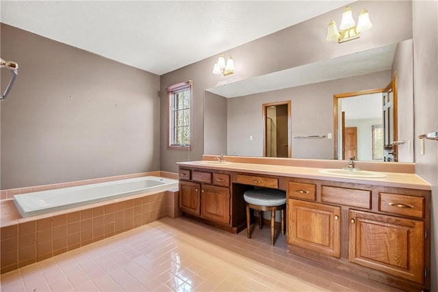 bathroom featuring tile patterned floors, vanity, and a relaxing tiled tub