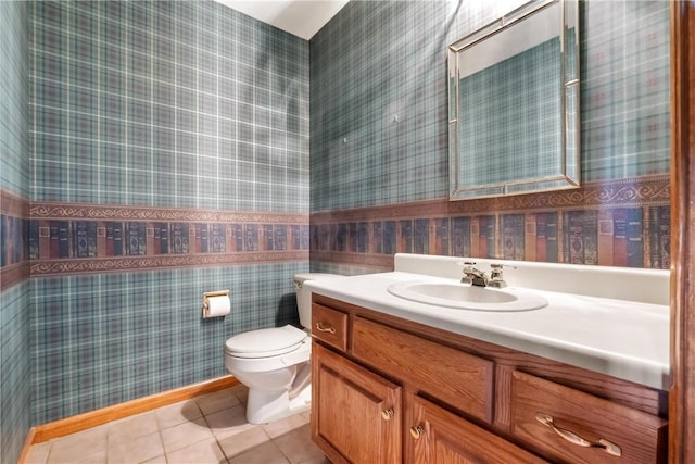 bathroom featuring tile patterned flooring, vanity, and toilet