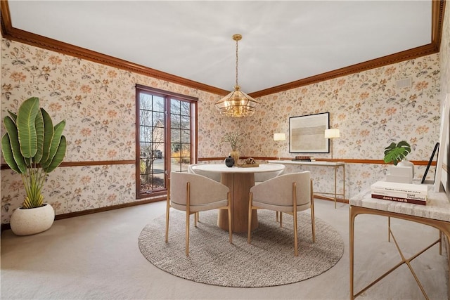 dining area with carpet, a notable chandelier, and ornamental molding