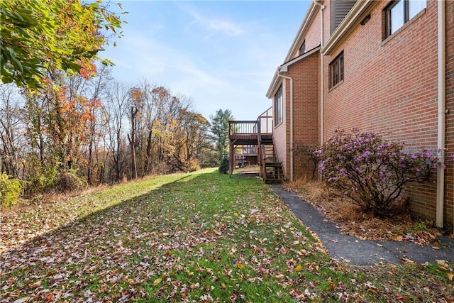 view of yard with a wooden deck