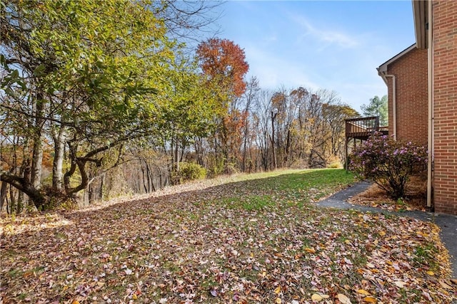 view of yard with a wooden deck