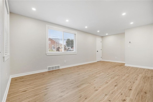 spare room featuring light hardwood / wood-style floors