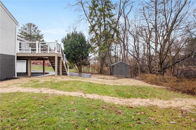 view of yard with a storage shed and a deck