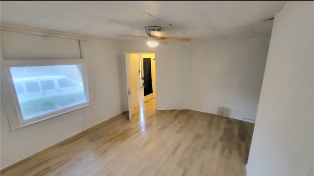 empty room with light hardwood / wood-style floors