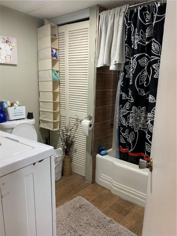 bathroom with vanity, wood-type flooring, and shower / tub combo