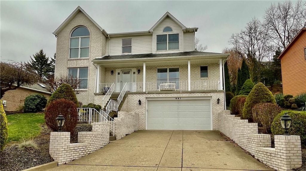 681 Adele Dr, North Huntingdon, PA 15642 - view of front of home with a porch and a garage