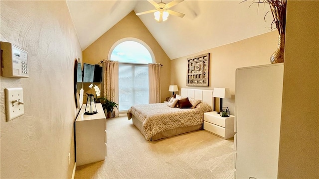 bedroom with carpet flooring, ceiling fan, and high vaulted ceiling