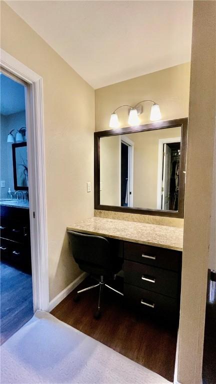 bathroom featuring vanity and wood-type flooring