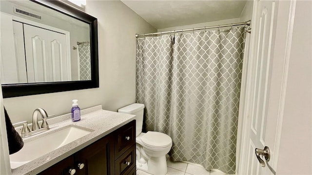 bathroom featuring tile patterned flooring, vanity, toilet, and a shower with curtain