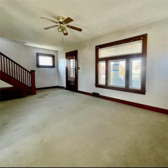 interior space featuring ceiling fan