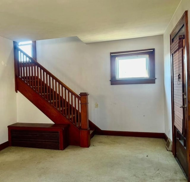 foyer with light carpet