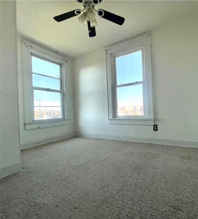 carpeted empty room with ceiling fan