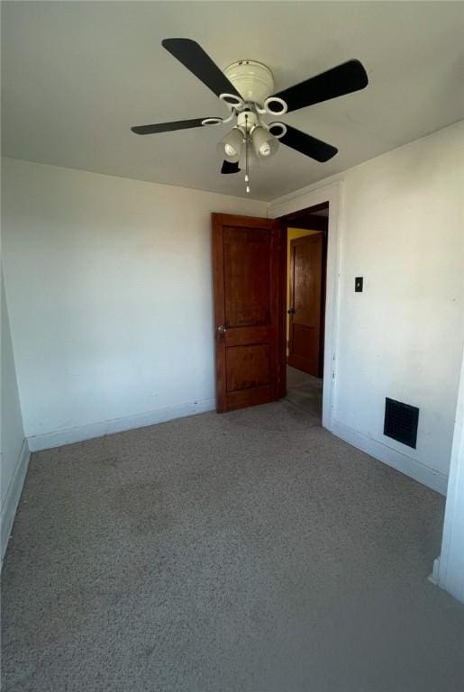 unfurnished room with light colored carpet and ceiling fan