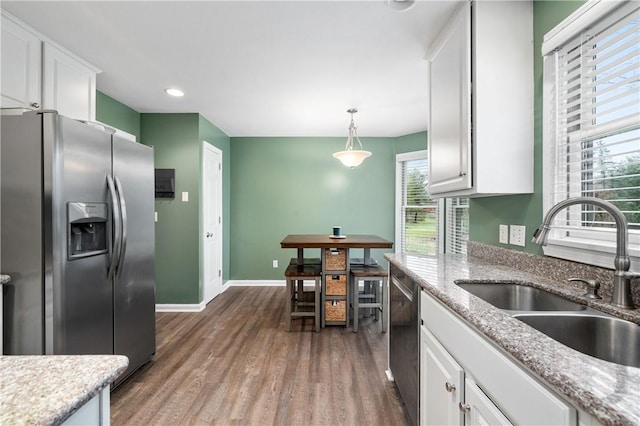 kitchen featuring white cabinetry, sink, and appliances with stainless steel finishes