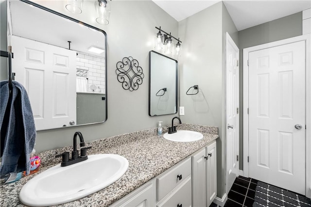 bathroom with tile patterned flooring and vanity