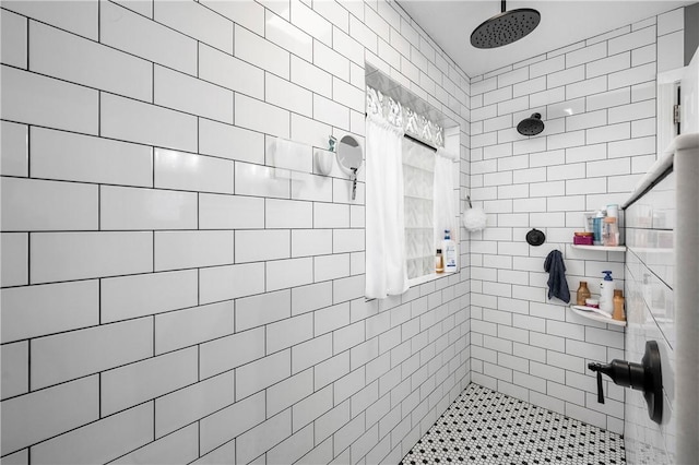 bathroom with tiled shower