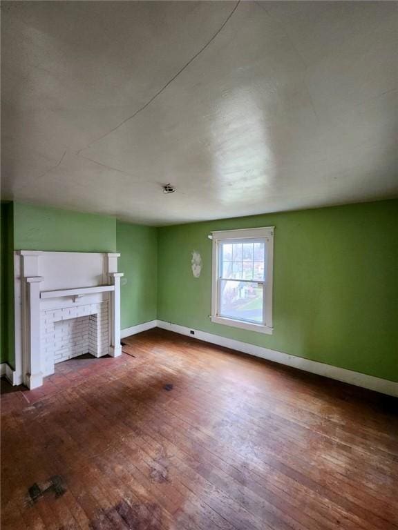 unfurnished living room featuring hardwood / wood-style flooring