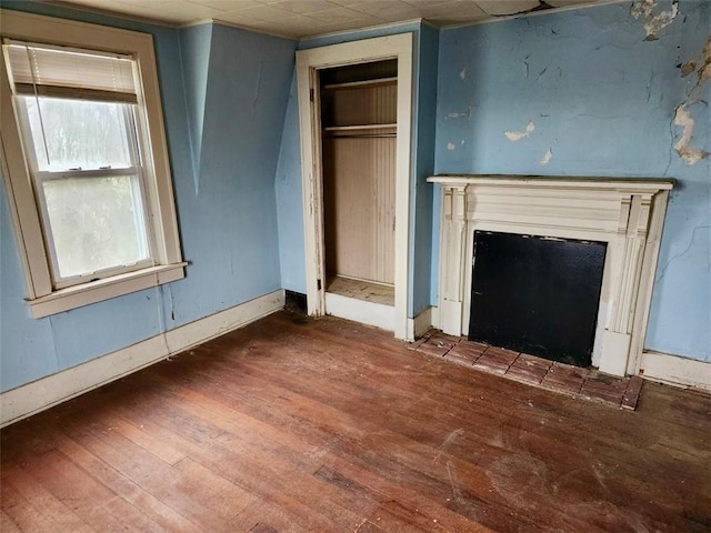 unfurnished living room featuring dark hardwood / wood-style flooring