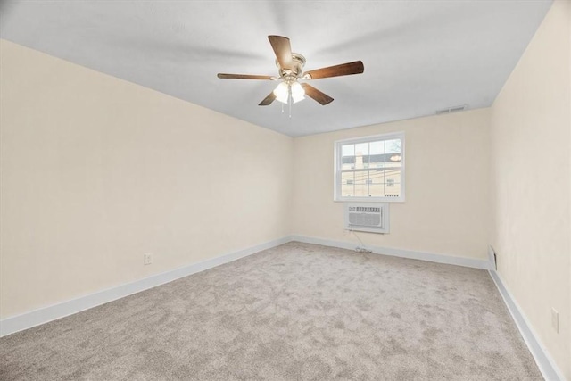 unfurnished room featuring light carpet, a wall mounted AC, and ceiling fan