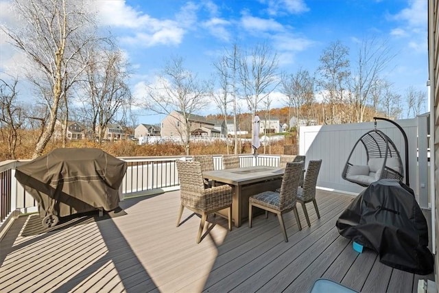 wooden terrace featuring a grill