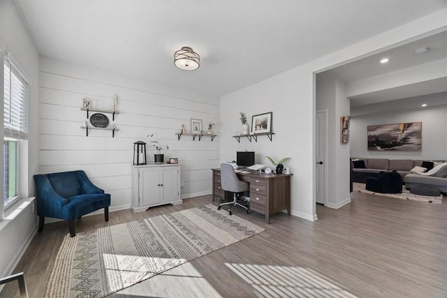 home office with hardwood / wood-style flooring