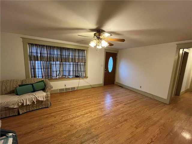 foyer featuring light hardwood / wood-style flooring and ceiling fan