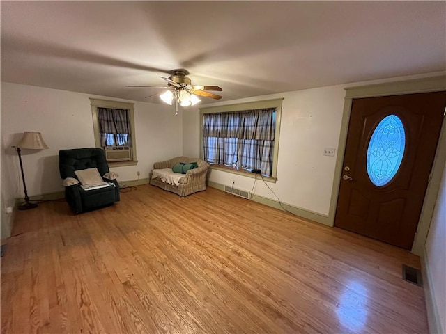 entrance foyer featuring ceiling fan and light wood-type flooring