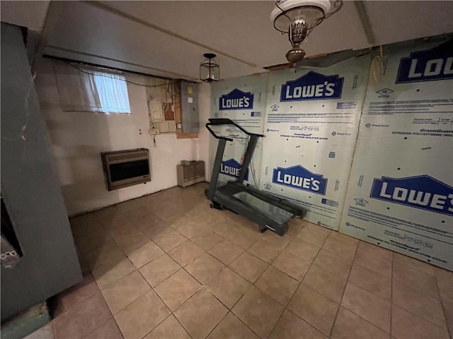 workout area with electric panel, heating unit, tile patterned floors, and a notable chandelier