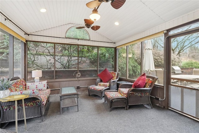 sunroom featuring vaulted ceiling, ceiling fan, and a healthy amount of sunlight