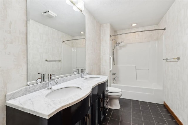 full bathroom with tile patterned flooring, vanity,  shower combination, and toilet