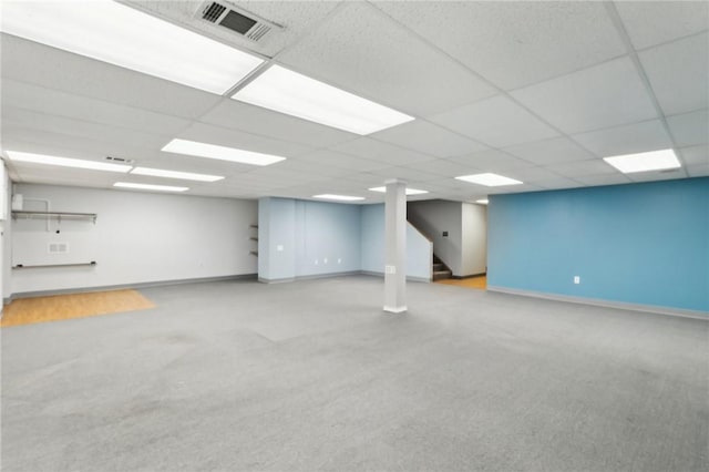 basement featuring a paneled ceiling