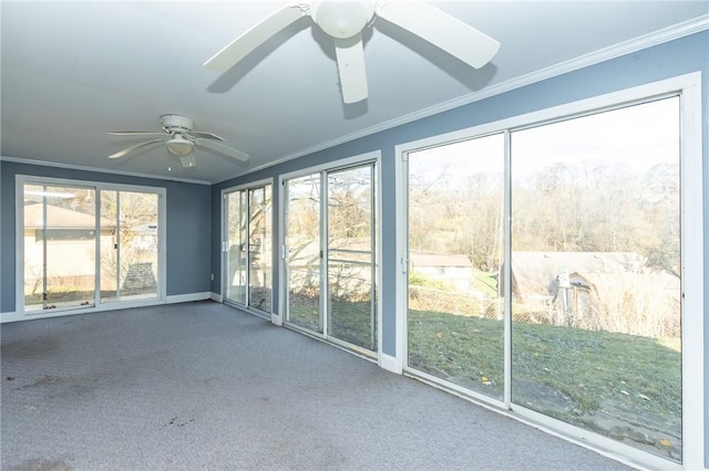 unfurnished sunroom with ceiling fan