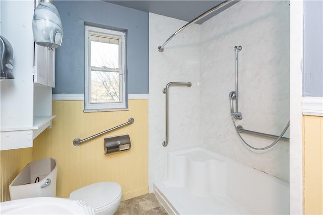 bathroom featuring toilet and walk in shower