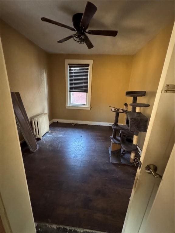 interior space featuring ceiling fan and radiator