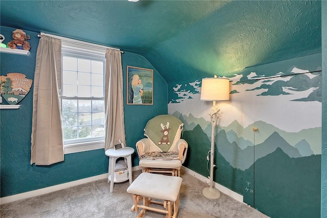 living area with lofted ceiling, a textured ceiling, and carpet floors