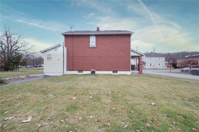 view of property exterior featuring a lawn