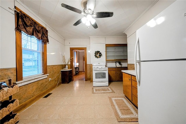 kitchen with white appliances and ceiling fan