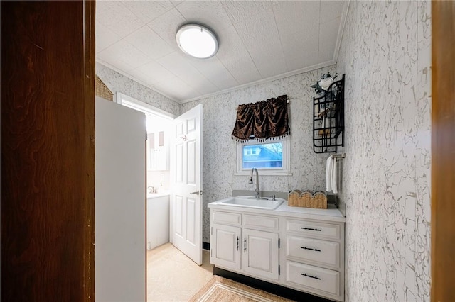 bathroom featuring vanity and crown molding