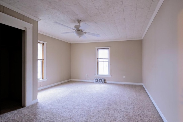 unfurnished room featuring ceiling fan, plenty of natural light, and crown molding