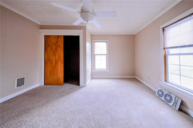 unfurnished bedroom featuring ceiling fan, a closet, and crown molding