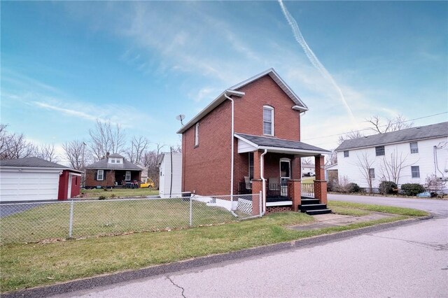 view of front facade with covered porch and a front lawn