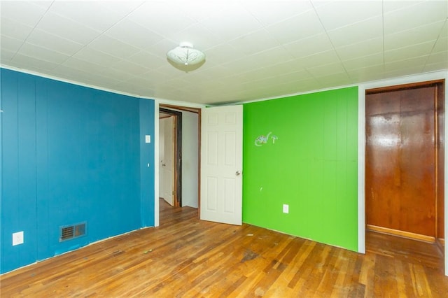 unfurnished bedroom featuring wood-type flooring